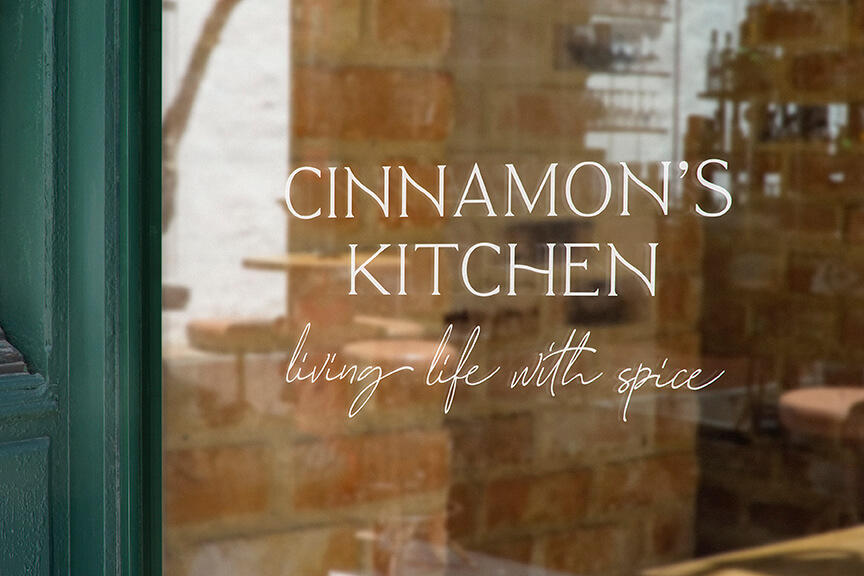 Cinnamon's Kitchen logo on front door designed by OneScout Agency in Bend, Oregon